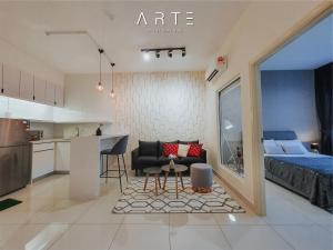a living room and kitchen with a couch and a table at Arte Mont Kiara Luxury Suite with Heated Jacuzzi Pods - Free Parking - Next to MITEC- by The Stay Hub in Kuala Lumpur +176 photos