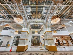 a lobby of a building with ornate ceilings and chandeliers at Arte Mont Kiara Luxury Suite with Heated Jacuzzi Pods - Free Parking - Next to MITEC- by The Stay Hub in Kuala Lumpur