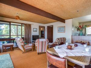 a dining room with a table and chairs at Hillside Haven by the Sea in Dromana