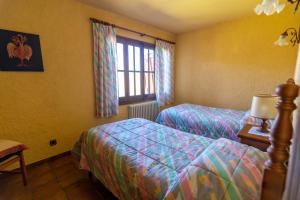 Postel nebo postele na pokoji v ubytování EVA & TRAVEL - El Bosquet de Prades