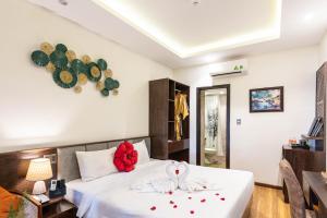 Postelja oz. postelje v sobi nastanitve Hoang Trinh Hotel