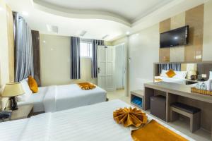 Postel nebo postele na pokoji v ubytování Oliver Hotel
