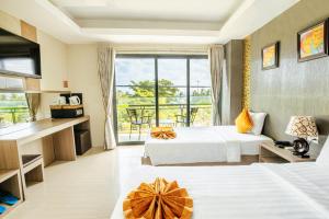 Postel nebo postele na pokoji v ubytování Oliver Hotel