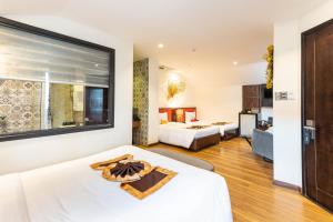 Postelja oz. postelje v sobi nastanitve Hoang Trinh Hotel