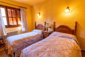 Postel nebo postele na pokoji v ubytování EVA & TRAVEL - El Bosquet de Prades
