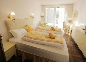 Postel nebo postele na pokoji v ubytování Garden Hotel Domaša