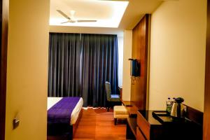 Postel nebo postele na pokoji v ubytování juSTa Palampur Resort & Convention Centre