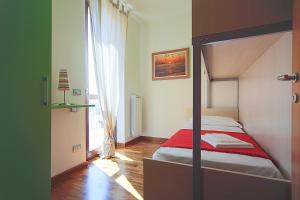 Postel nebo postele na pokoji v ubytování Adamo ed Eva Resort