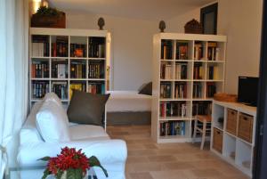 a living room with book shelves filled with books at Chic & Country in Lecce