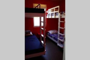 a room with two bunk beds and a window at PARACAS megaview bayfront flat in Paracas