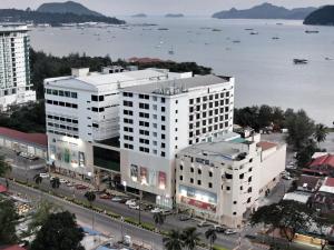 an overhead view of a large white building next to the water at Hotel Langkasuka Langkawi in Kuah