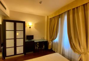 Ένα ή περισσότερα κρεβάτια σε δωμάτιο στο Hotel Kristall