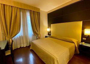 Ένα ή περισσότερα κρεβάτια σε δωμάτιο στο Hotel Kristall