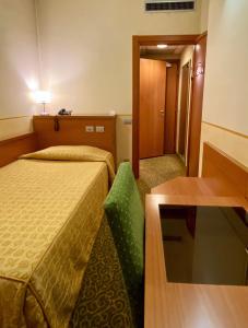 Ένα ή περισσότερα κρεβάτια σε δωμάτιο στο Hotel Kristall