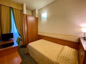 Ένα ή περισσότερα κρεβάτια σε δωμάτιο στο Hotel Kristall