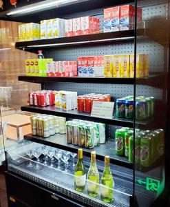 a refrigerator filled with lots of different types of drinks at Crowne Plaza Yibin, an IHG Hotel in Yibin