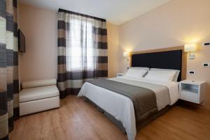 Postel nebo postele na pokoji v ubytování Relais Le Felci Executive Suite Spa
