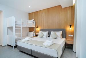 a bedroom with a bed and a bunk bed at Daria Essence in Limenas +80 photos