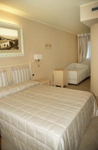 Кровать или кровати в номере La Casa di Gino