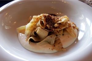 a white plate with some food on it at Amadé Pension in Siculeni