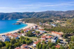 an aerial view of a resort and a beach at House Aggeliki in Kalamitsi