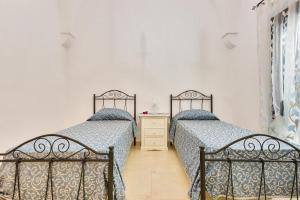 Posteľ alebo postele v izbe v ubytovaní Dependance di Cristina by BarbarHouse