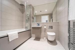 a bathroom with a toilet and a sink at Seven Living Residences Solihull - Close to NEC & BHX - Free Parking in Solihull