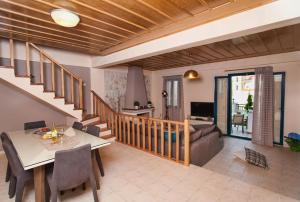 A television and/or entertainment centre at Peonia and Ortansia Villas - Few Steps from the beach