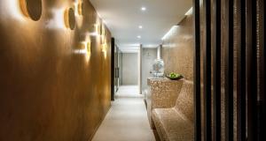 a hallway with a long corridor with a hallway at Hotel Ambasador - Liburnia in Opatija