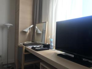 Televiisor ja/või meelelahutuskeskus majutusasutuses Sunrise Choshi