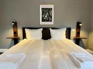 Postel nebo postele na pokoji v ubytování Unique Hotel Jungfrugatan