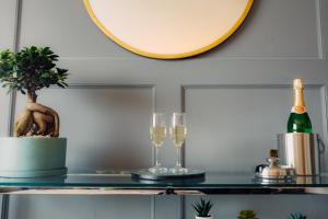 a table with two glasses and a bottle of wine at Hotel Imperial Dundalk in Dundalk