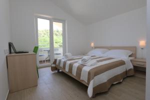 Кровать или кровати в номере Apartments Sucic Iva i Tea