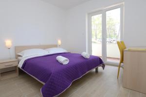 Кровать или кровати в номере Apartments Sucic Iva i Tea