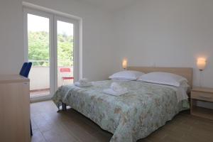 Кровать или кровати в номере Apartments Sucic Iva i Tea