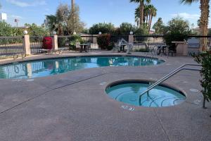 a small swimming pool in the middle of a patio at Days Inn by Wyndham Blythe in Blythe