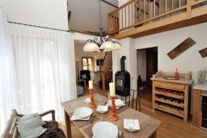 a living room with a table and a wood stove at Heritage Dürnstein in Dürnstein