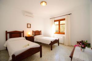 Katil atau katil-katil dalam bilik di Finca Pleta de sa Punta