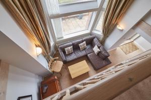 an overhead view of a living room with a couch and a table at Host & Stay - Sunset View in Whitby