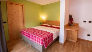 Postel nebo postele na pokoji v ubytování Hotel Bellevue