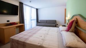 Postel nebo postele na pokoji v ubytování Hotel Bellevue