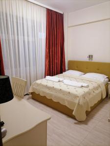 a bedroom with a bed in a room at Hotel Florentina in Constanţa