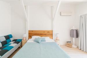 A bed or beds in a room at Friends Family Hotel