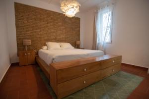 Postel nebo postele na pokoji v ubytování VILLA DEL RIU