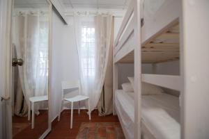 Postel nebo postele na pokoji v ubytování VILLA DEL RIU