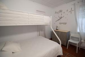 Postel nebo postele na pokoji v ubytování VILLA DEL RIU