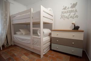 Postel nebo postele na pokoji v ubytování VILLA DEL RIU