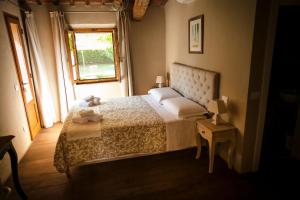 Postel nebo postele na pokoji v ubytování Mulino in Chianti