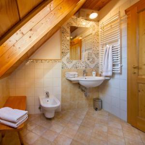a bathroom with a sink and a toilet at Farm Stay Pirc in Laško +18 photos