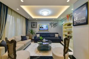 a living room with a couch and a table at Kare Hotel Sultanahmet in Istanbul